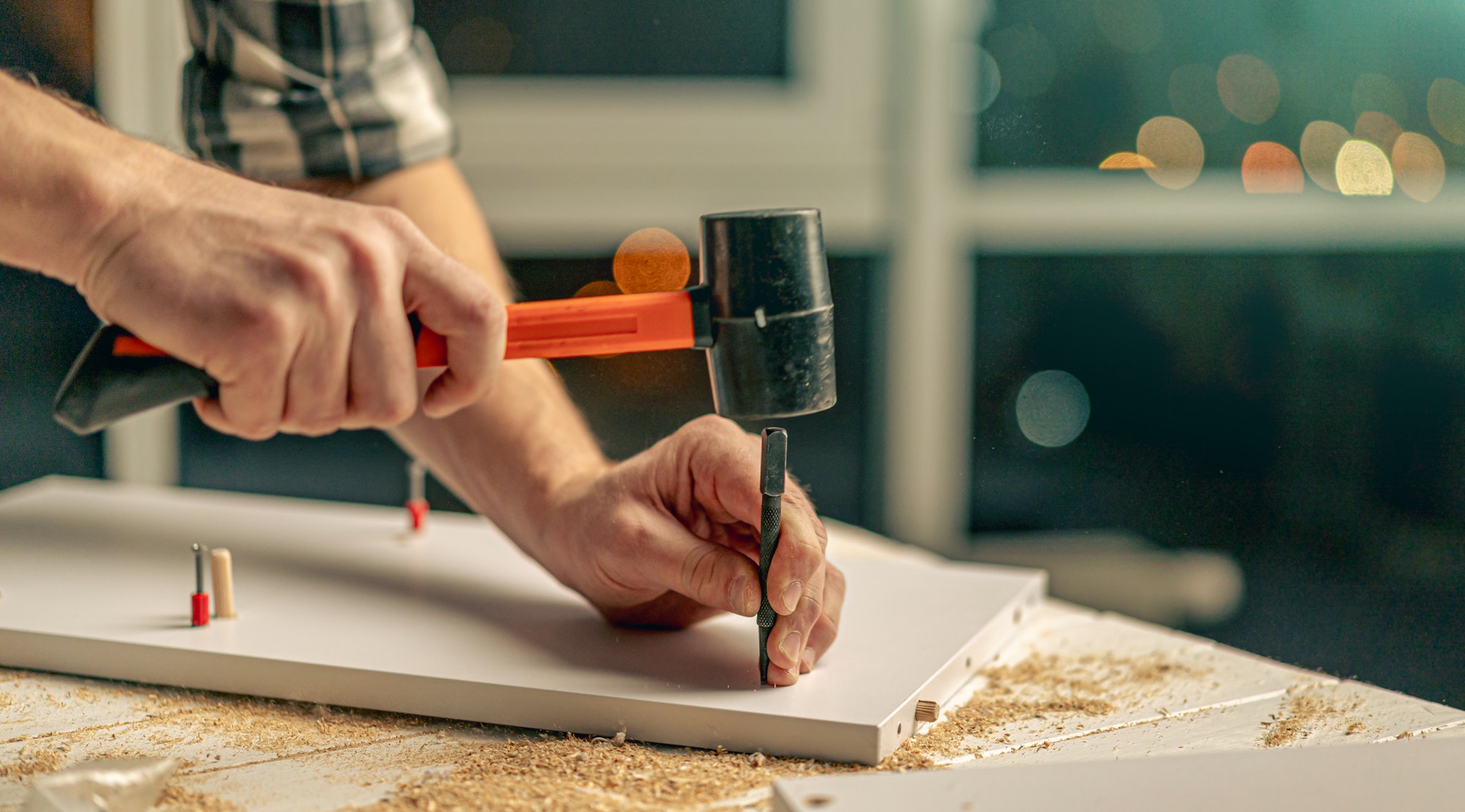 Man working during process of furniture manufacturing